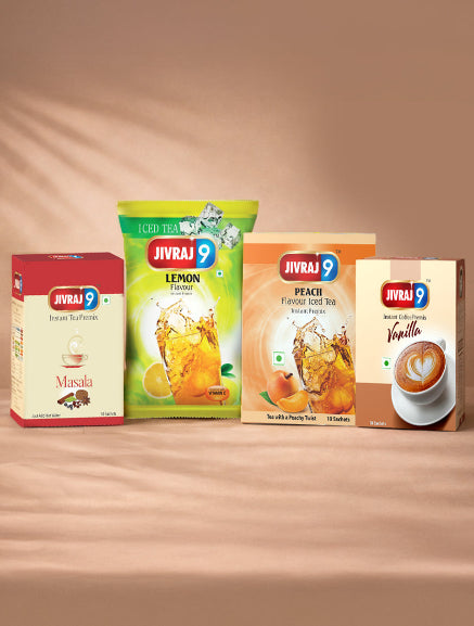 Four Jivraj 9 tea packages on a wooden surface with a gradient background